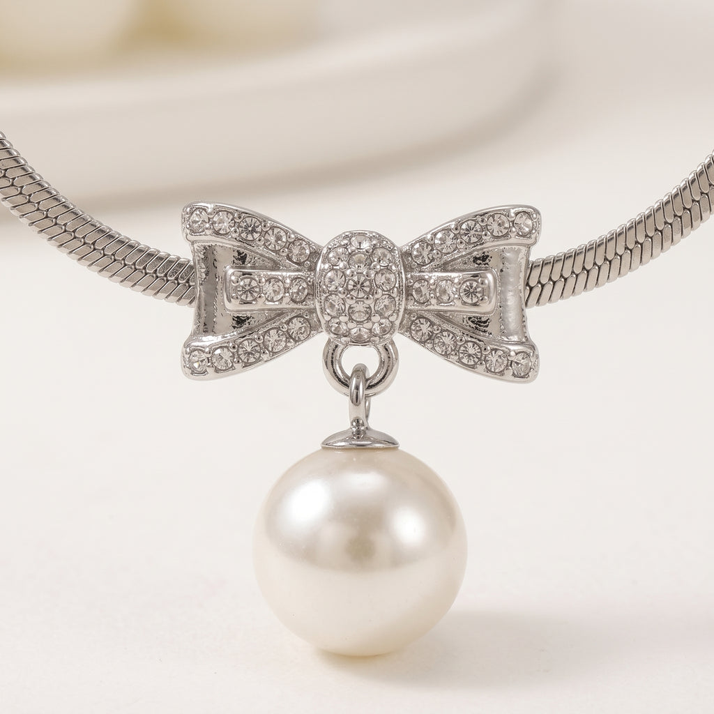 Pearl Bow Pendant Necklace — Silver Snake Chain