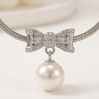 Pearl Bow Pendant Necklace — Silver Snake Chain