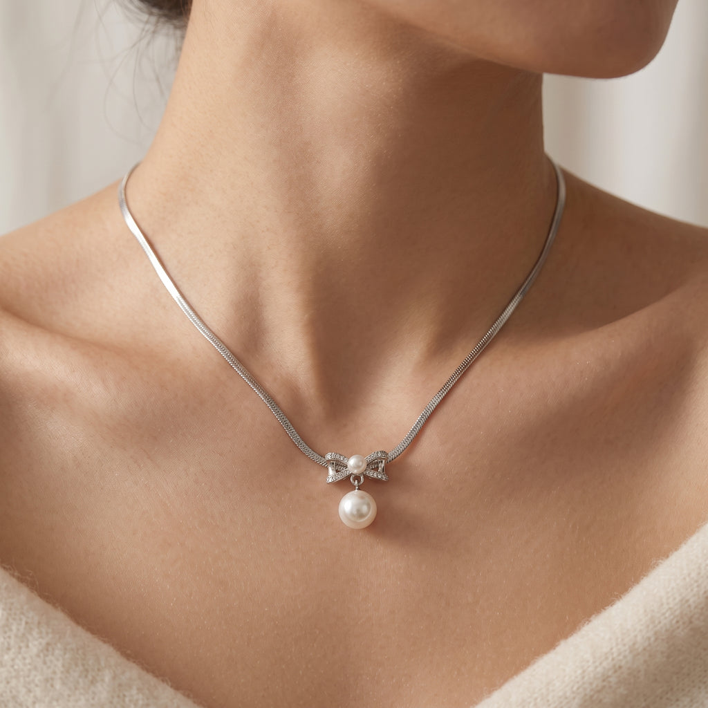 Pearl Bow Pendant Necklace — Silver Snake Chain