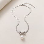 Pearl Bow Pendant Necklace — Silver Snake Chain