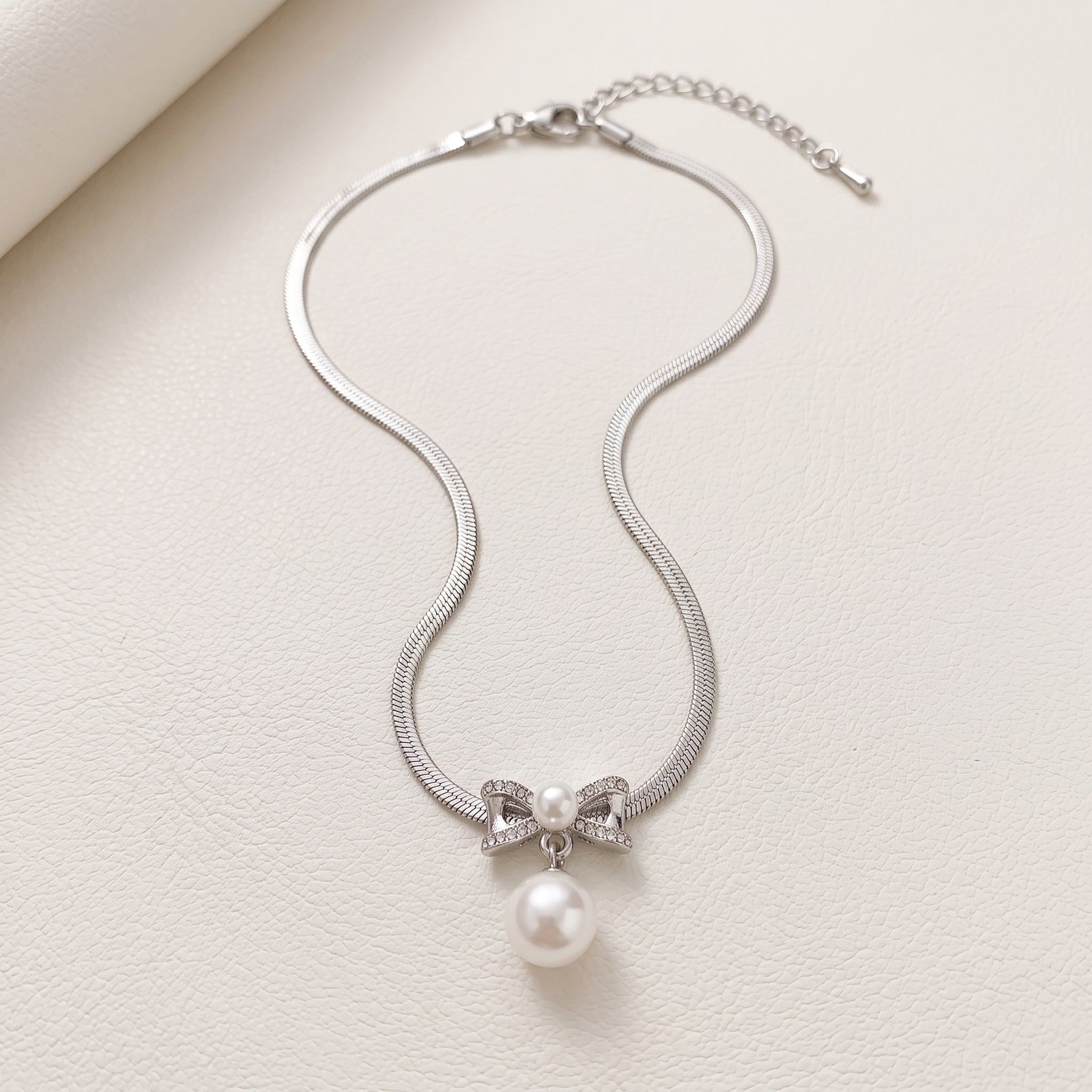 Pearl Bow Pendant Necklace — Silver Snake Chain